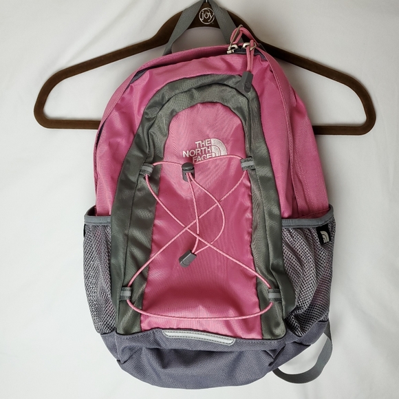 north face white and pink backpack